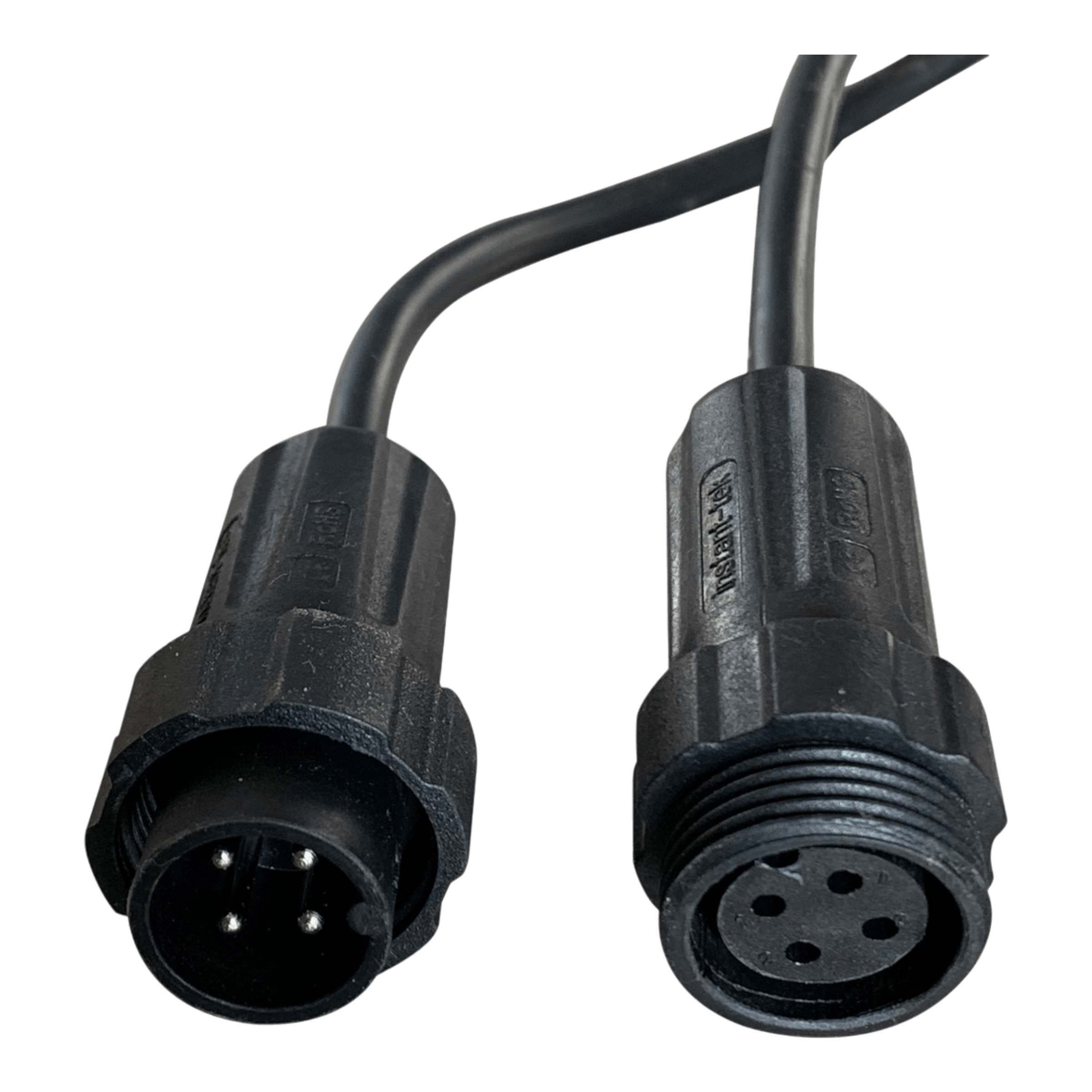 Two black connectors with multiple pins from the PIERCE 2 Function Wireless Control System for Dump Trailer are positioned on a black background, showcasing both ends and reflecting the precision engineering typical of hydraulic pumps.