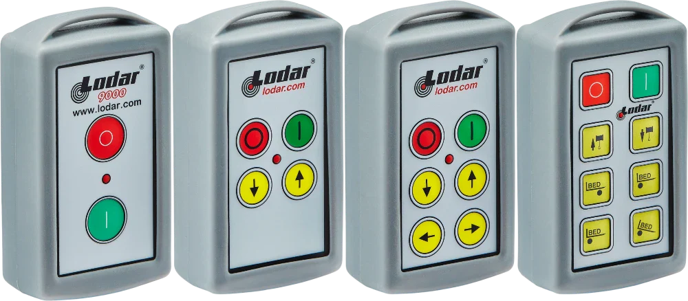 Four gray Lodar remote controls with varying numbers of colorful round and square buttons on each unit.
