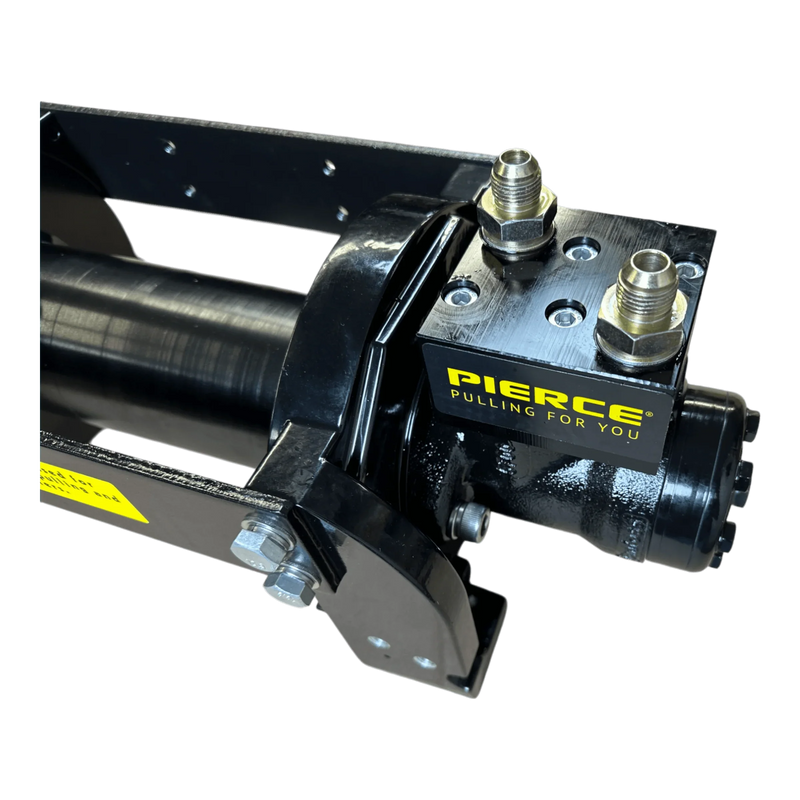 Close-up of a black 10,000 lb Hydraulic Recovery Winch by Internal - Pierce Assembly Team, featuring a "PIERCE PULLING FOR YOU" label and metal fittings for industrial recovery tasks.
