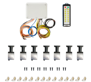 A sleek electronic control system, the 14 Function Wireless Air System with Bolt on Actuator by PIERCE, featuring a junction box, remote, and cables with Husco valves and metal components is arranged neatly on a black background.