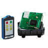 A 2 Function 110V IP Wireless Control System by Lodar LTD, featuring the Relay Receiver from the 96 Series with a remote control, showcases an open electronic circuit board with green components on a black base, all set against a white background.