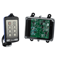 The 2 Function Stainless Steel IP Wireless Control System from Lodar LTD's 92 Series, featuring a FET Receiver, includes buttons placed alongside a clear-cased electronic circuit board, making it perfect for industrial environments.