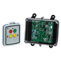 A compact mini remote with colorful buttons sits beside a transparent circuit board casing, ideal for controlling solenoid-operated equipment using the 2 Functions Mini Wireless Control System from Lodar LTD's 92 Series FET Receiver.