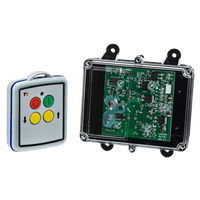 A compact mini remote with colorful buttons sits beside a transparent circuit board casing, ideal for controlling solenoid-operated equipment using the 2 Functions Mini Wireless Control System from Lodar LTD's 92 Series FET Receiver.