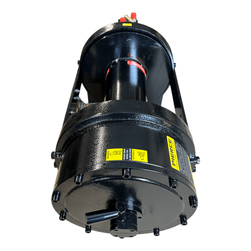 The PIERCE 30,000 lb Hydraulic Recovery Winch with long drum and manual clutch features yellow labels and bolts, built for heavy recovery, shown from a low front angle on a white background.