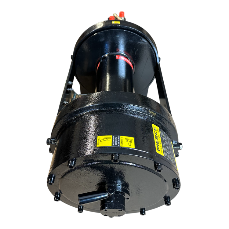 The PIERCE 30,000 lb Hydraulic Recovery Winch, featuring a long drum and manual clutch, is showcased from a low angle. It displays bold yellow labels and sturdy bolts on its powerful black industrial frame.