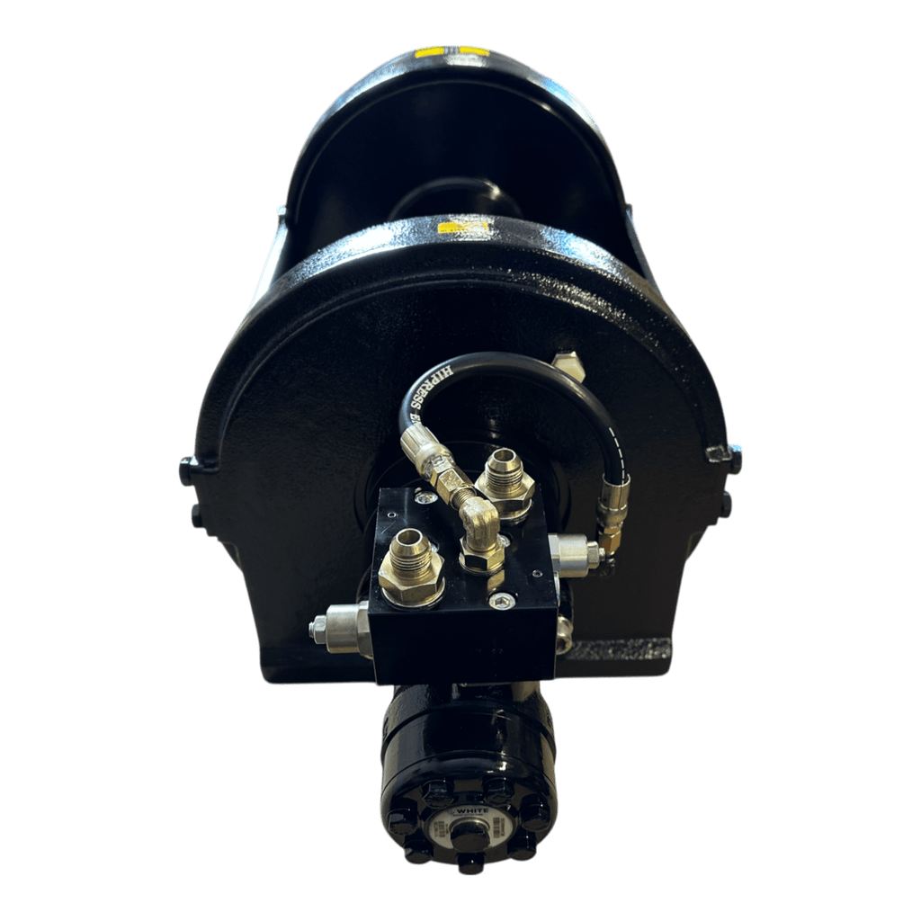 Front view of the PIERCE 30,000 lb Hydraulic Recovery Winch with long drum and manual clutch, black finish, featuring visible hoses and metal fittings for heavy recovery operations, shown on a white background.