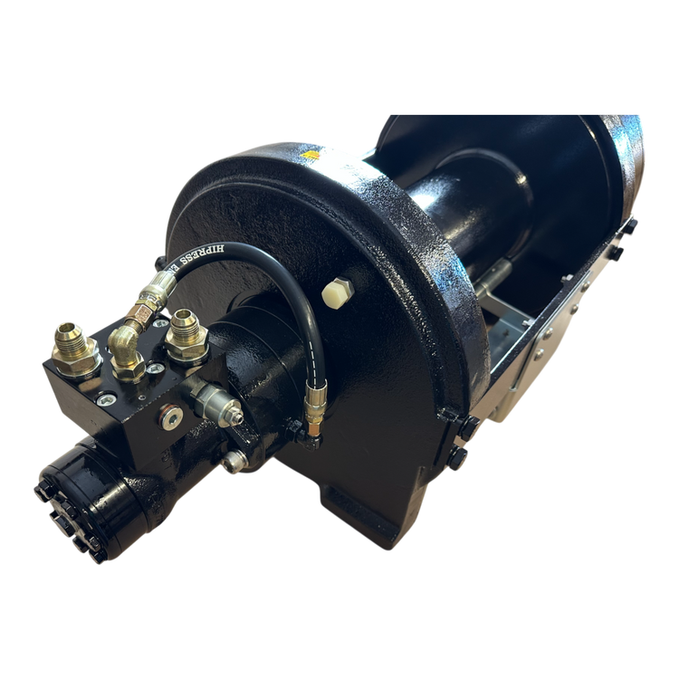 Close-up of a black hydraulic brake drum, showcasing attached hoses and fittings consistent with the robust design of PIERCE's 30,000 lb Hydraulic Recovery Winch. The setup includes a compact 30 planetary gear arrangement to ensure efficient performance.