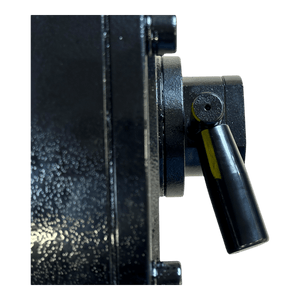 Close-up of a black mechanical lever on the textured metallic surface of the 30,000 lb Hydraulic Recovery Winch with a Narrow Drum and Air Clutch by PIERCE.