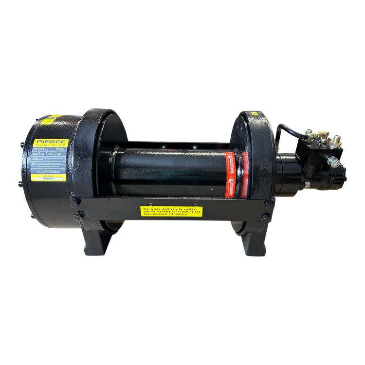 The PIERCE 30,000 lb Hydraulic Recovery Winch with a Narrow Drum and Manual Clutch is showcased on a black background. This industrial winch features a central drum and labels, using a manual clutch along with a planetary gear system to provide precision and power for demanding applications.