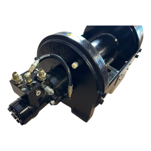 Close-up of the PIERCE 30,000 lb Hydraulic Recovery Winch with a narrow drum, featuring a black industrial hydraulic motor, connected hoses, metal fittings, and an integrated planetary gear system.