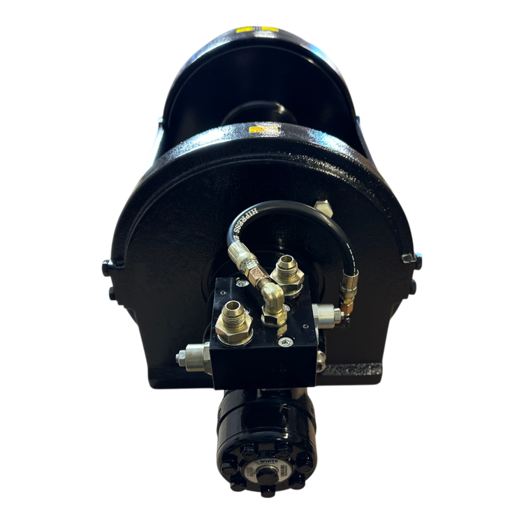 A PIERCE 30,000 lb hydraulic recovery winch with a narrow drum, robust manual clutch, and advanced planetary gear system rests elegantly against a dark backdrop.