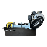Side view of the PIERCE 110V Electric Winch – 7,500 lb, featuring a black and silver design, yellow warning label, split drum, and electric worm-gear mechanism.