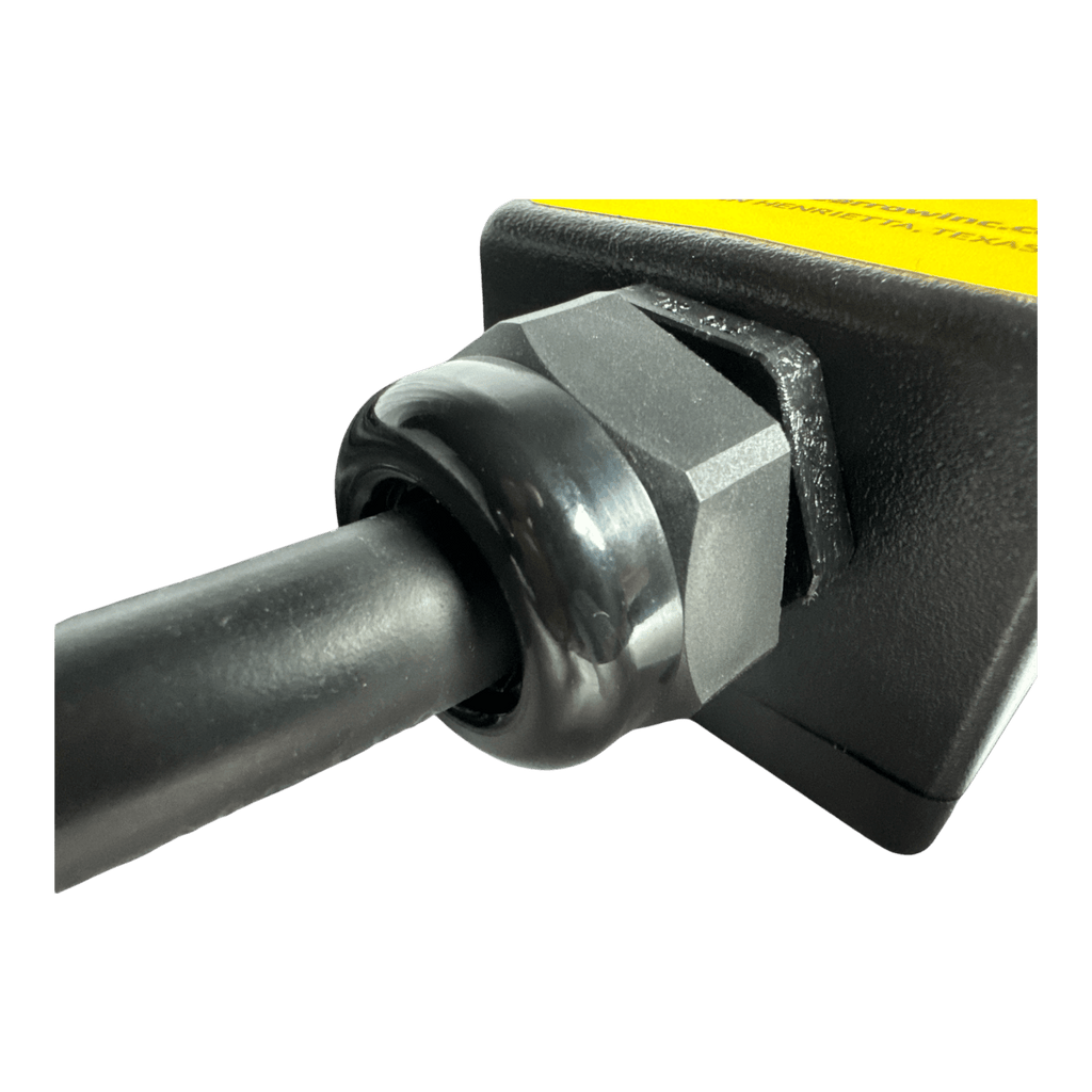 Close-up of a black cable secured with a plastic cable gland to the PIERCE 8 Function Wrecker Remote, commonly used in 12/24V solenoid systems or hydraulic power units.