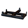 The PIERCE Drop Hinge for Gooseneck Bale Spear features a black metal design with a rectangular base and four mounting points, offering versatility and precision integration, all against a dark backdrop.
