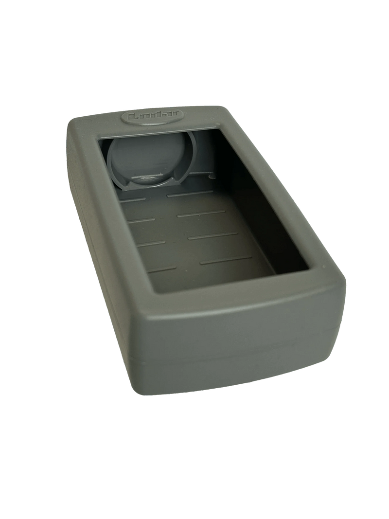 The Lodar LTD Silcone LoCate Cover for AirTag™ is a rectangular gray case with an open compartment, circular recessed area near the top, and built-in impact protection for a secure fit.