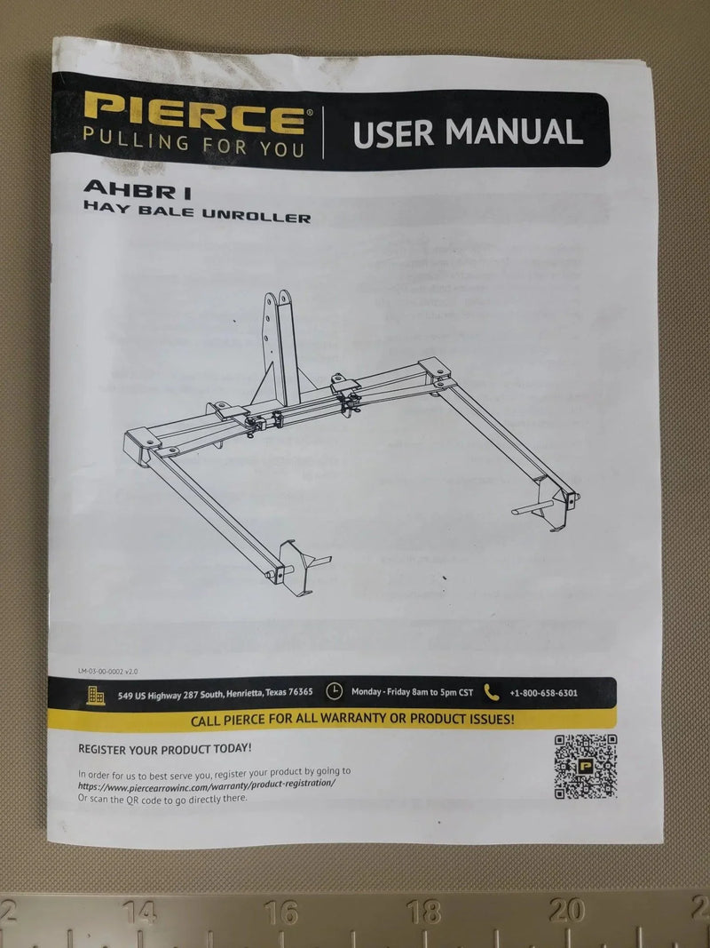 PIERCE Bale Unroller Extension Set user manual with assembly diagram on the cover, lying on a tan surface—includes info for unrolling hay bales and using extensions with 4 ft round hay bales.