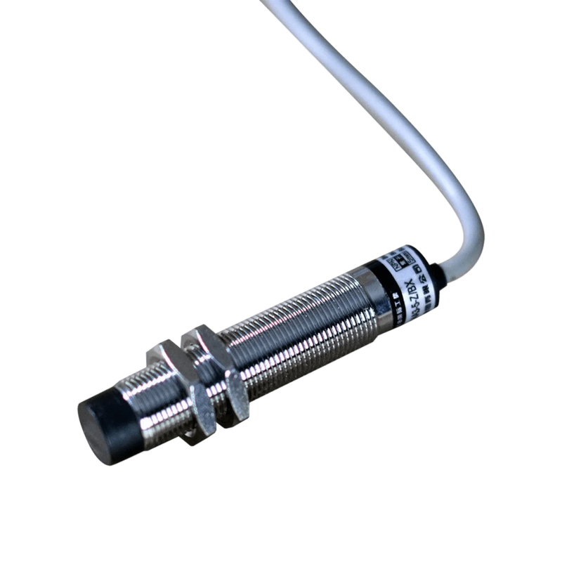 Close-up of a cylindrical metal proximity sensor with a cable attached, seamlessly integrated into the Cattle Cube Counter system by PIERCE to optimize feeding costs.