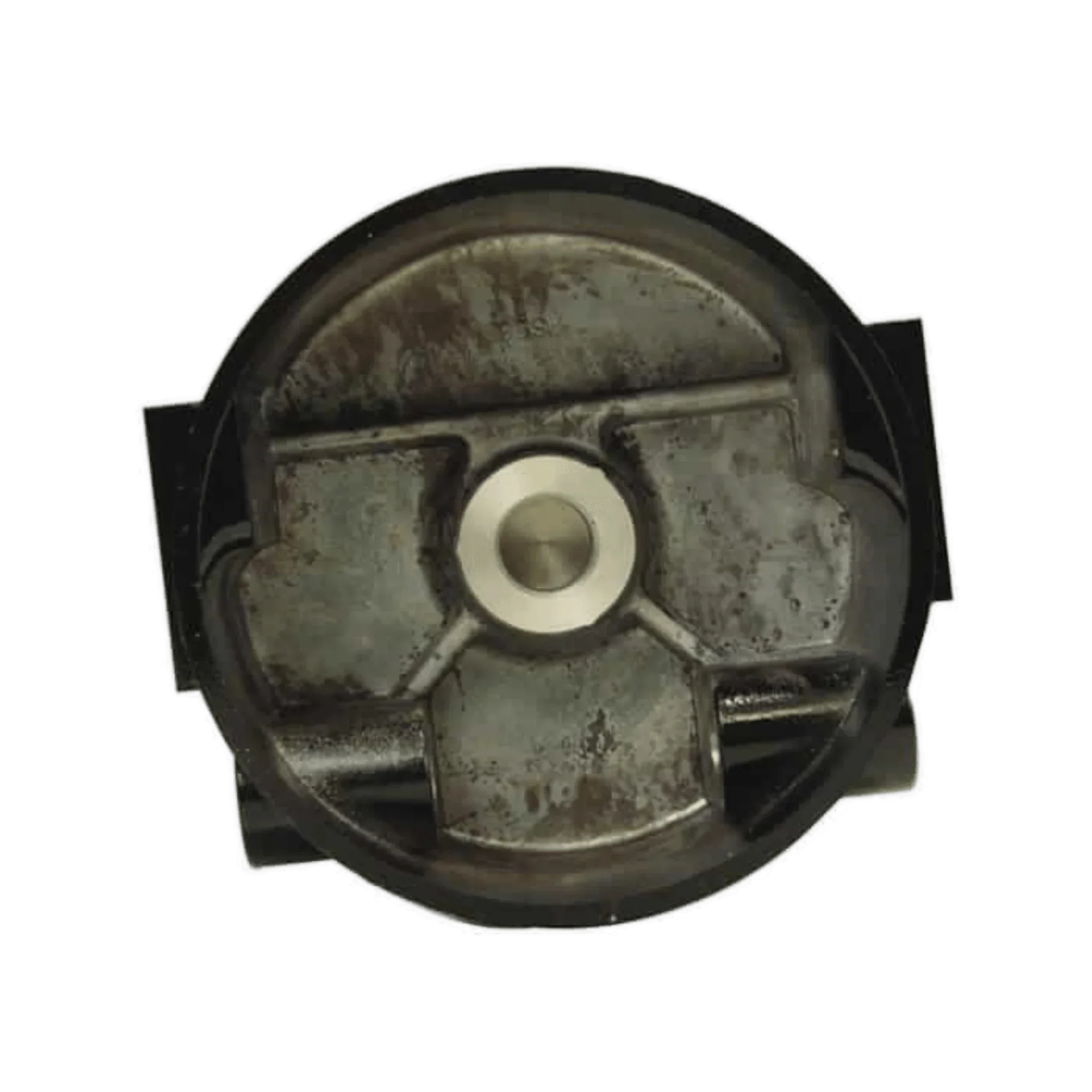 Top view of a round, metallic piston with a worn surface and central indentation, resembling the rugged durability of PIERCE Clutch Housing w/ Bushing for Worm Gear Winches.