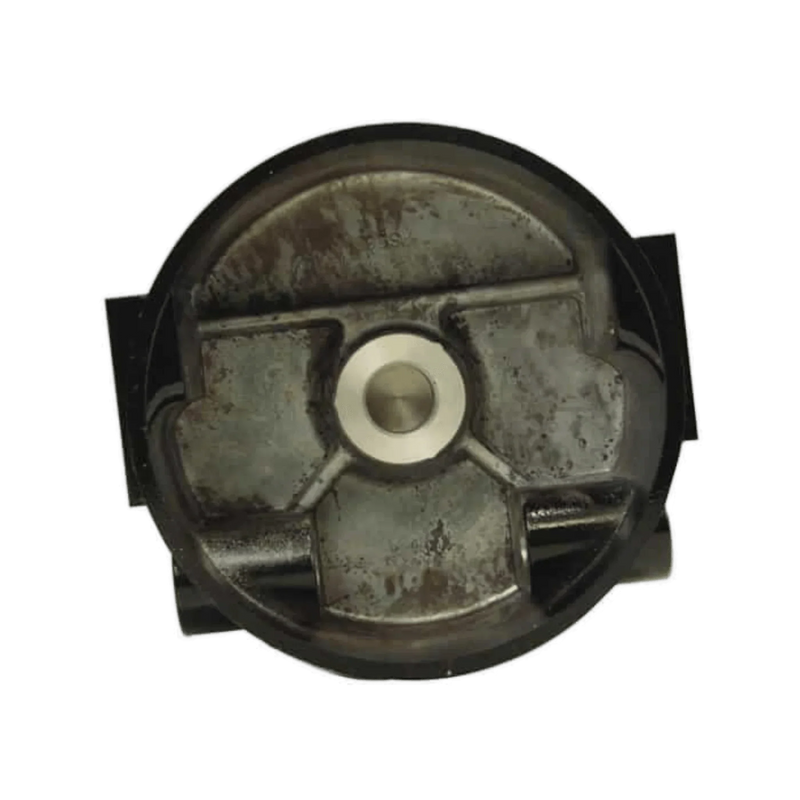 Top view of a round, metallic piston with a worn surface and central indentation, resembling the rugged durability of PIERCE Clutch Housing w/ Bushing for Worm Gear Winches.