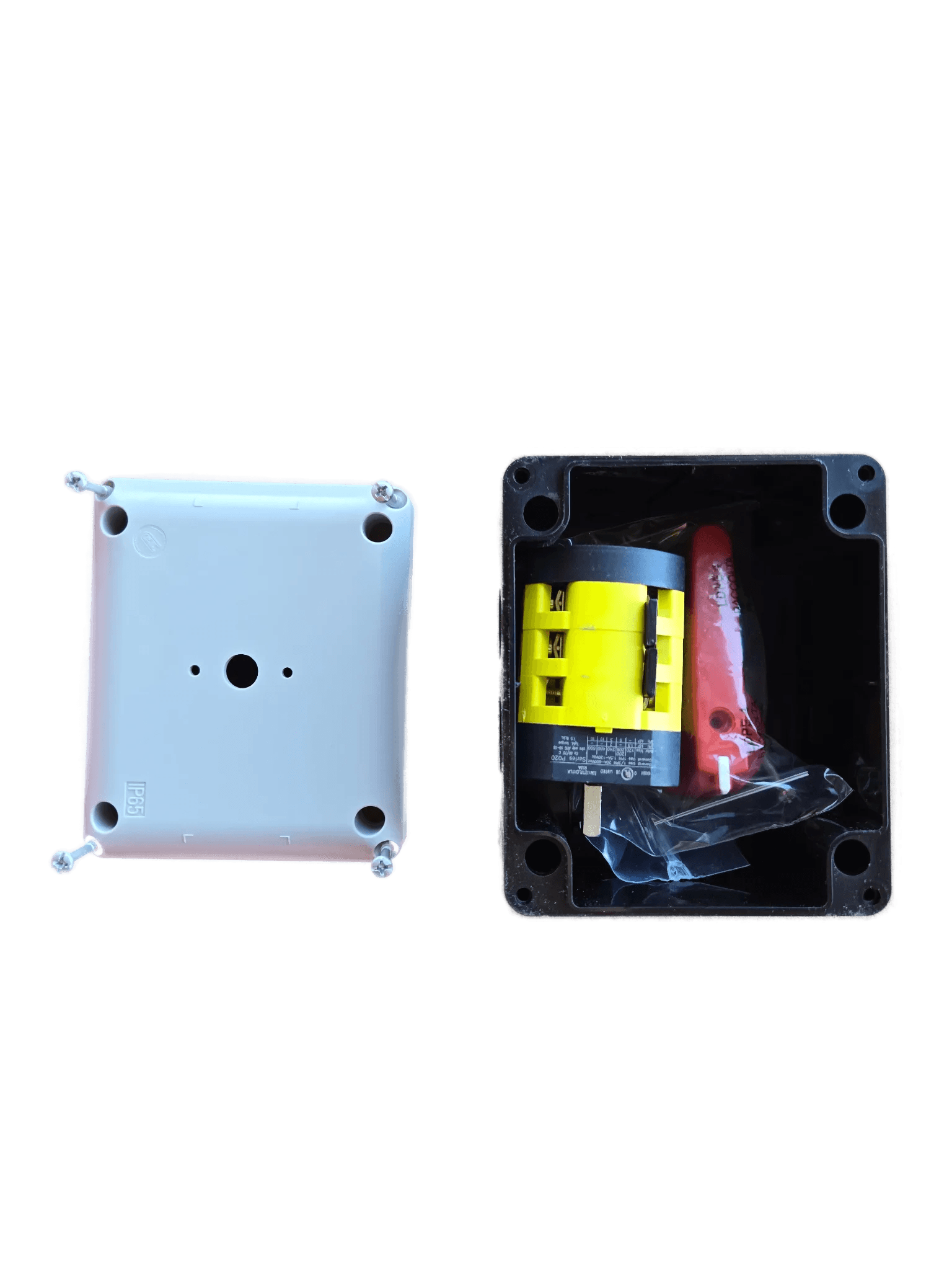 An open PIERCE Control Box for 110V PIERCE 654 Series Single Phase Winch sits next to a white cover on cardboard, commonly used in industrial settings.