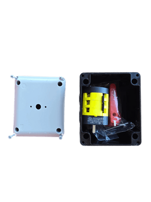 An open PIERCE Control Box for 110V PIERCE 654 Series Single Phase Winch sits next to a white cover on cardboard, commonly used in industrial settings.