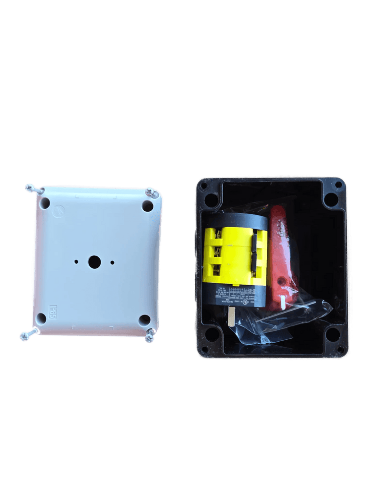 An open PIERCE Control Box for 110V PIERCE 654 Series Single Phase Winch sits next to a white cover on cardboard, commonly used in industrial settings.