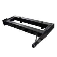The PIERCE Drop Hinge for Bolt-In Bale Spear is a black metal skid steer attachment plate with angled edges, compatible with ABS2K Bolt-in Bale Spike, shown on a white background.