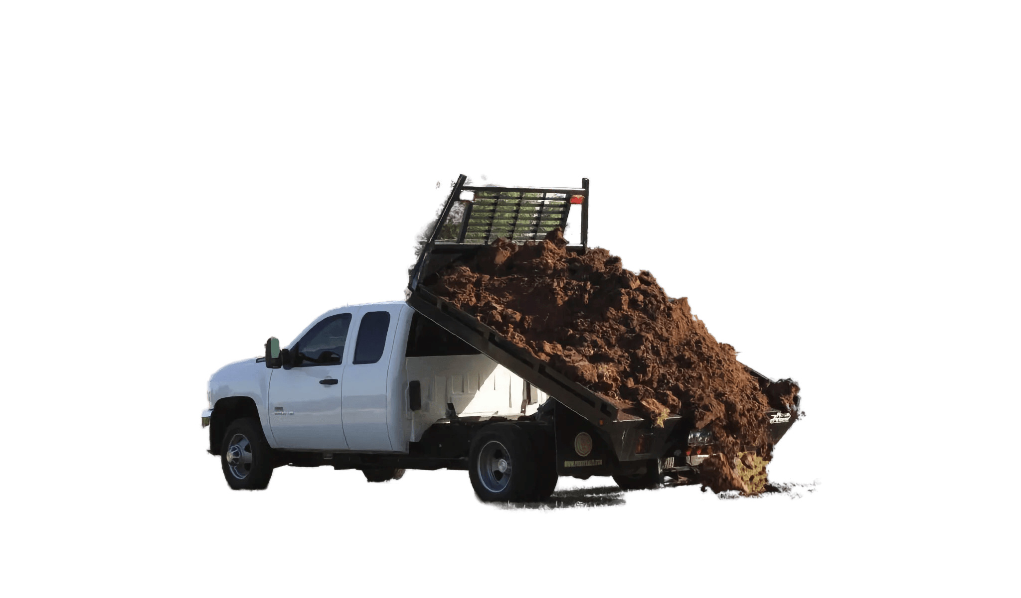 A white dump truck with a PIERCE Light Duty Flat Bed Dump Kit and a 12 Volt hydraulic pump unloads dirt onto a grassy field, trees in the background.