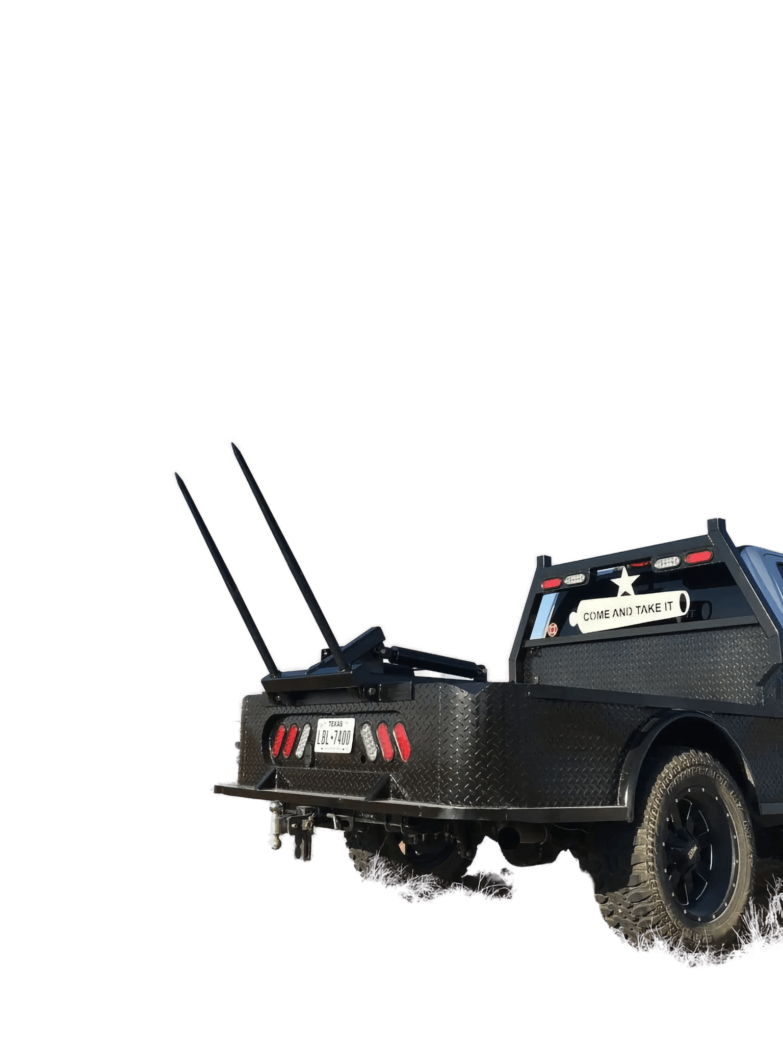 A black pickup with a PIERCE Truck Bed Gooseneck Hay Bale Mover, metal pipes, and a "Come and Take It" sign on the flatbed.