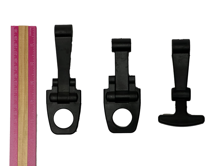 Three PIERCE Coolers Latches in black plastic of varying sizes are placed next to a pink and beige ruler on a white background.