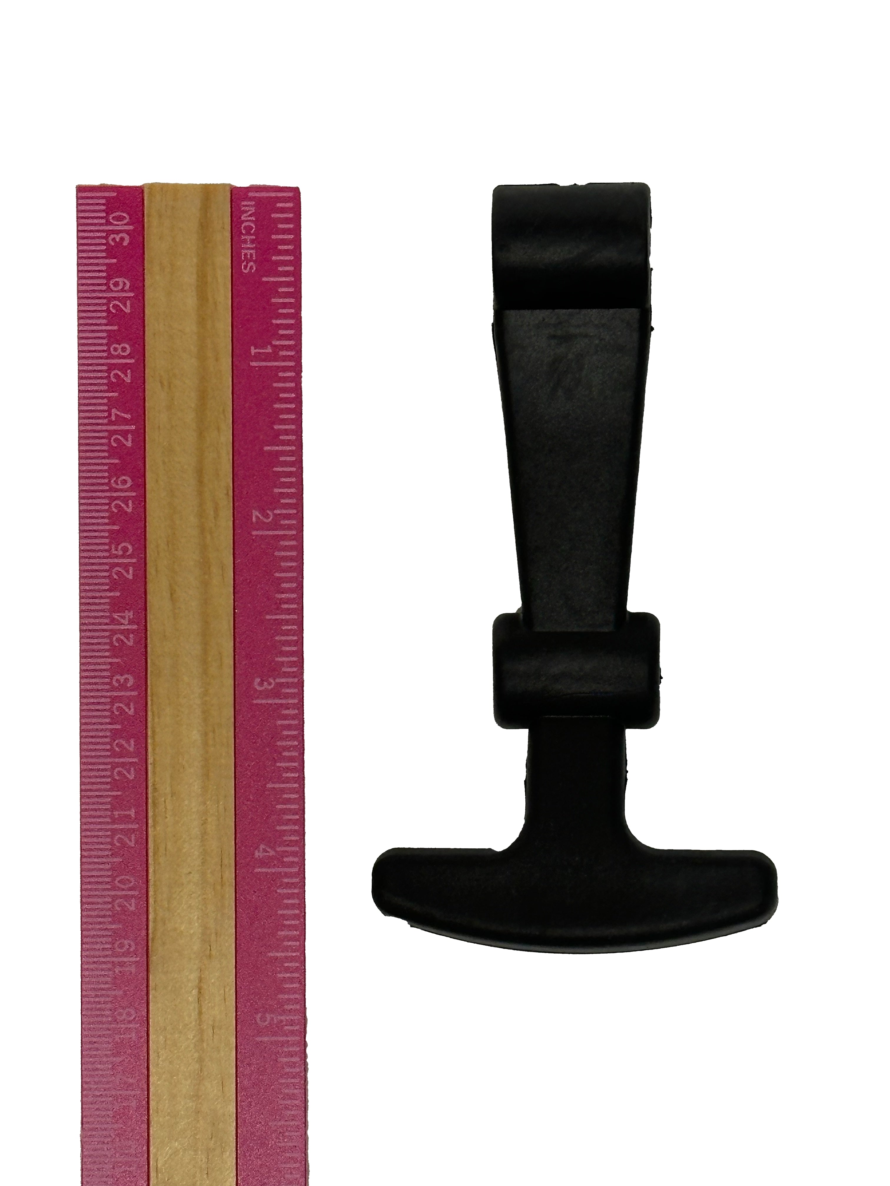 A black plastic latch by PIERCE positioned next to a wooden ruler with a pink edge.