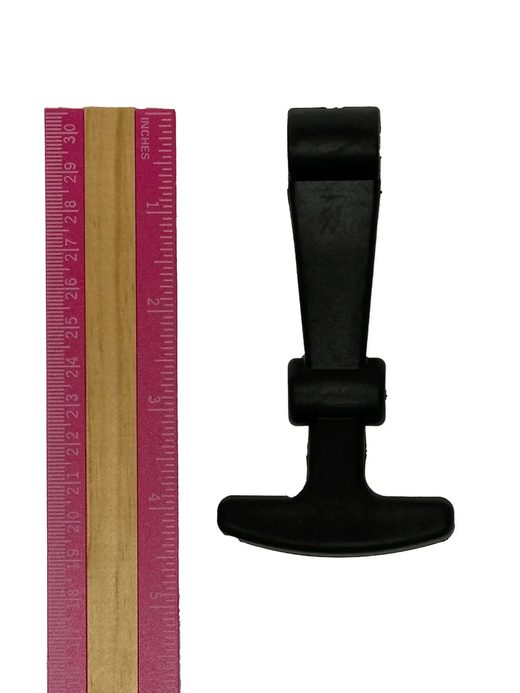 A pink ruler is placed beside a black, T-shaped PIERCE Coolers | Latch on a white background.