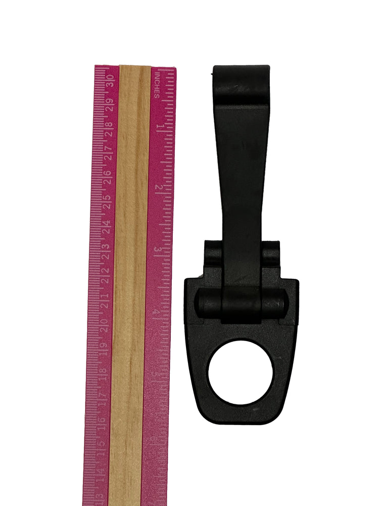 A PIERCE Coolers Latch Long Version 2 next to a pink measuring ruler against a white background.