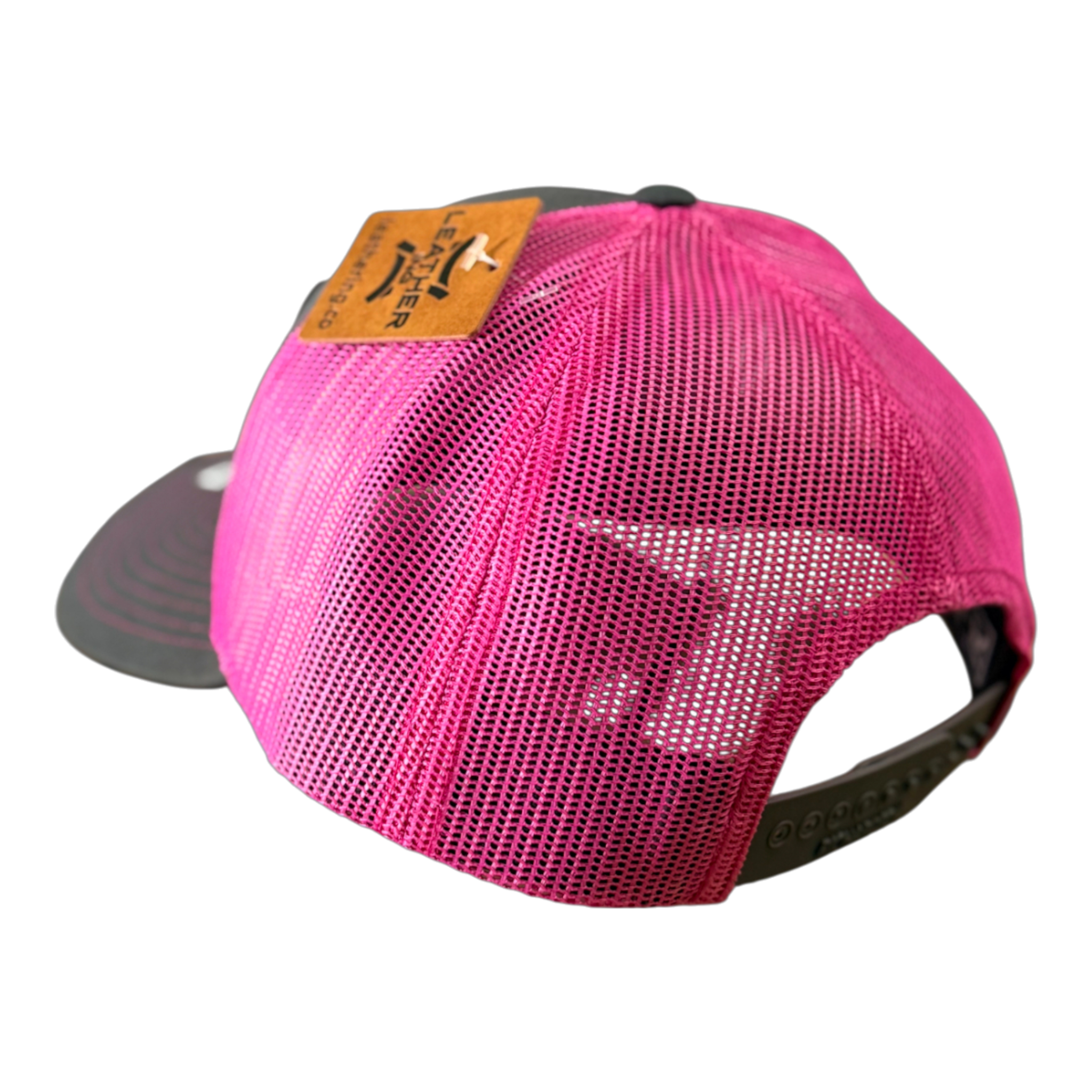 The VAXMATE Trucker Hat with Leather Patch by PIERCE is a pink mesh Richardson 112 cap featuring a black snapback and brown leather patch, shown from the back.