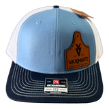 The PIERCE VAXMATE Trucker Hat with Leather Patch features a blue and white design, brown VAXMATE ear tag patch, and an adjustable Richardson 112 label.