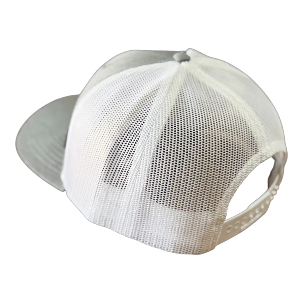 White mesh-back VAXMATE Trucker Hat by PIERCE with leather patch and adjustable snap closure, viewed from the back on a white background—classic Richardson 112 style.