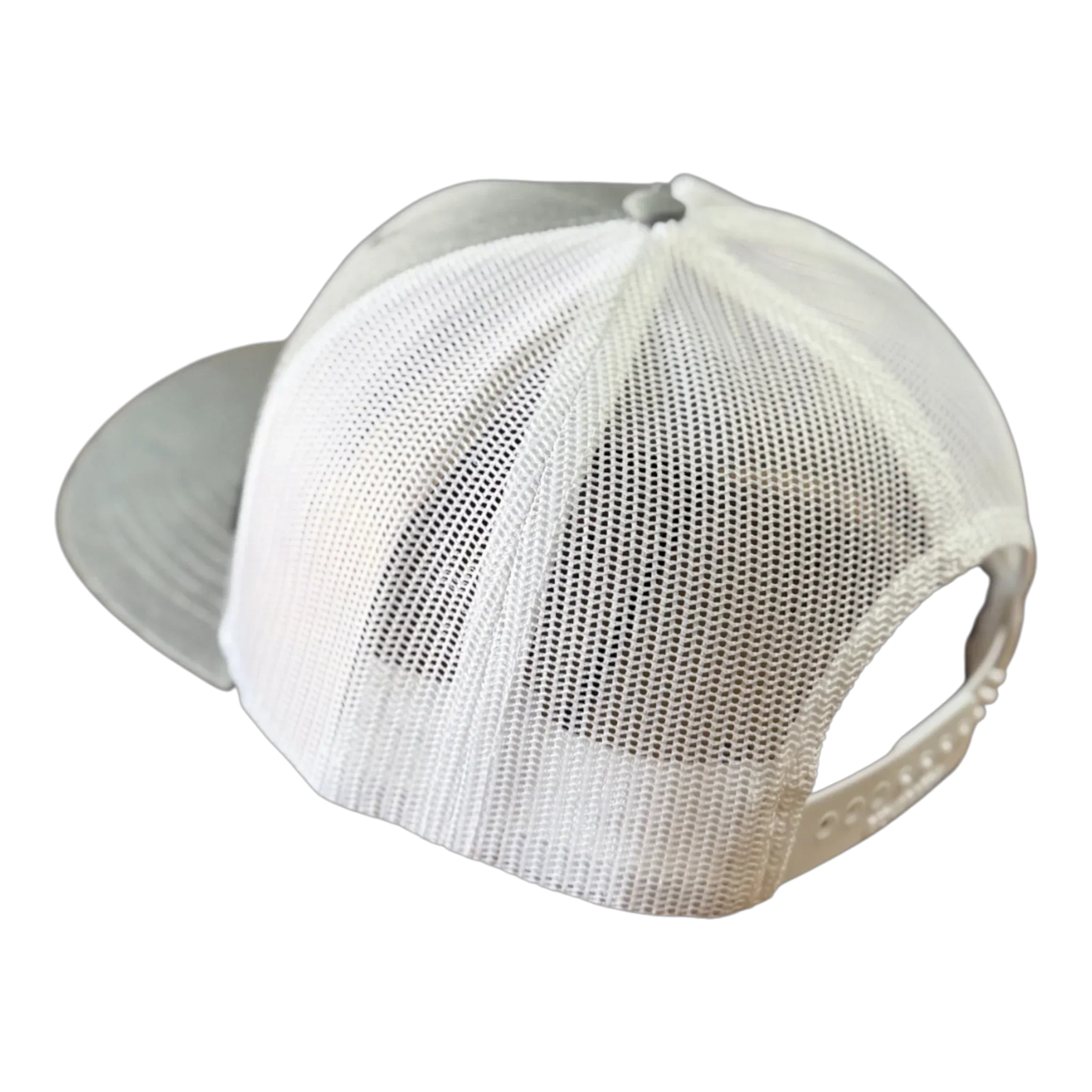 White mesh-back VAXMATE Trucker Hat by PIERCE with leather patch and adjustable snap closure, viewed from the back on a white background—classic Richardson 112 style.