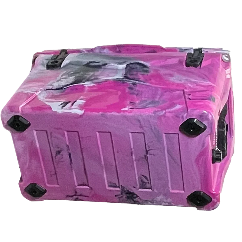 The PIERCE 45 Quart Camo Cooler by PIERCE features a pink and purple marbled hard-shell with black corner protectors, inspired by rugged roto-molded coolers for durability and long ice retention—combining style and protection.