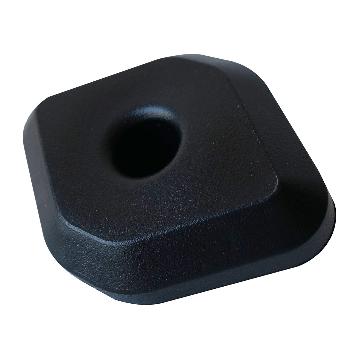 Angled view of a black rectangular Coolers foot rubber pad by PIERCE, featuring a central hole.