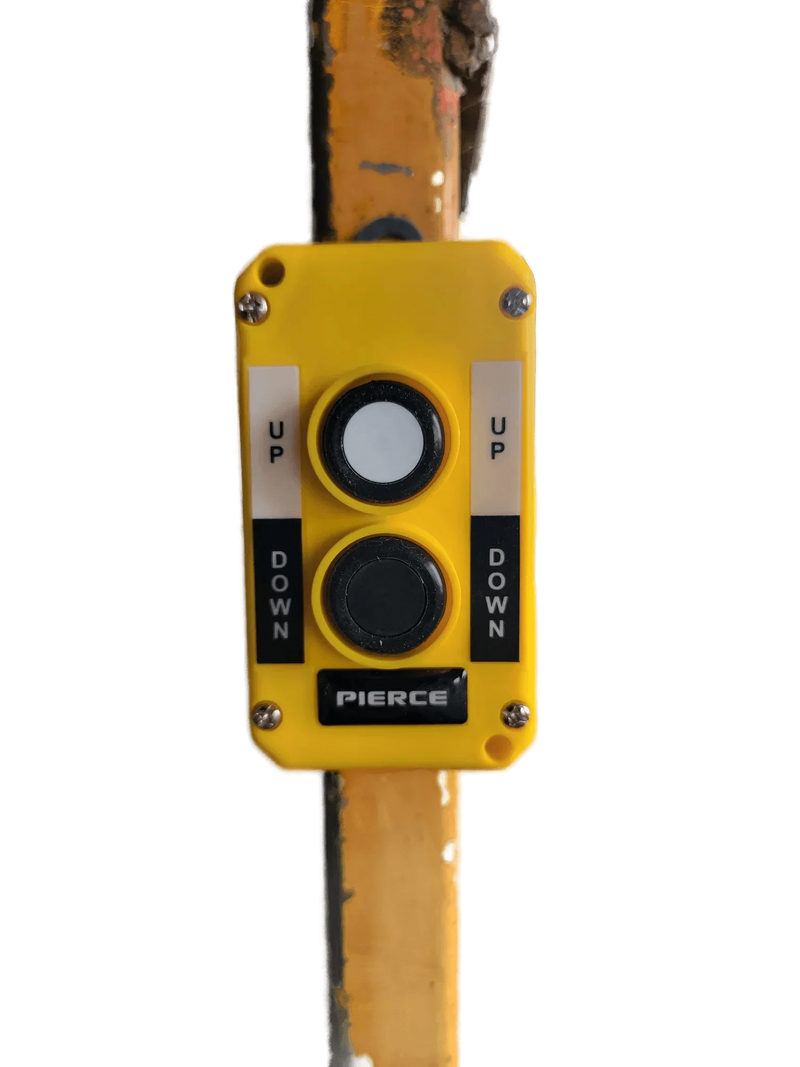 The Asetek Enterprise Company LTD Universal Momentary Pendant Control - 2 Button features a yellow case with black "UP" and "DOWN" buttons, mountable on a pole—ideal for hydraulic power unit control in industrial settings.