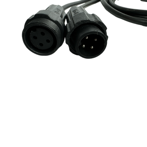 Close-up of two black circular audio connectors with multiple pins, resembling the complex components found in the PIERCE 2 Function Wireless Control System for Dump Trailer, set against a dark background.
