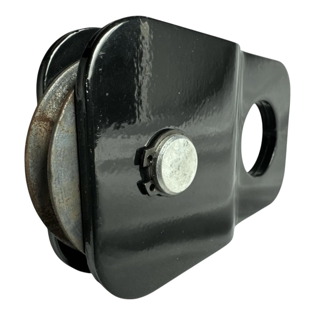 The PIERCE Snatch Block WLL 6,000 lbs. is a black metal pulley with a circular hole and visible rust on the wheel, designed for winch pulling up to 6,000 lbs.