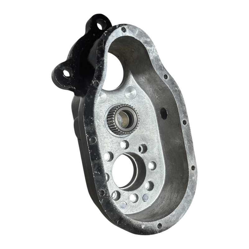The PIERCE Transfer Housing | 654 Series | 12,500 lbs features an oval-shaped metal body with multiple holes and a bearing, perfect as a transfer housing or PS654 winch replacement. Shown on a white background.