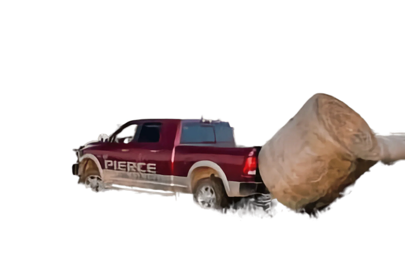 A red pickup equipped with the PIERCE Truck Bed Gooseneck Hay Bale Mover hauls a large hay bale on a white background.