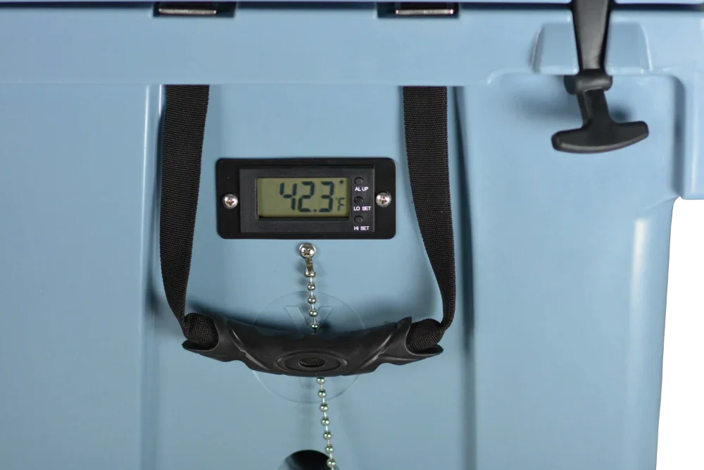 Close-up of a digital thermometer reading 42.3°F attached to a blue PIERCE VaxMate Vaccine Cooler with a black latch.