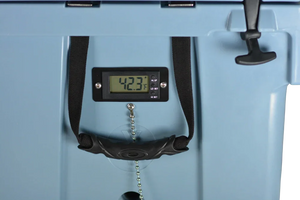 Close-up of a digital thermometer reading 42.3°F attached to a blue PIERCE VaxMate Vaccine Cooler with a black latch.