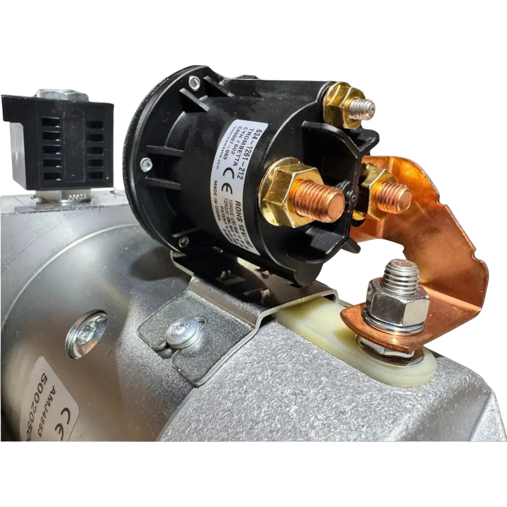 Close-up of a Bucher Hydraulics, Inc. Bucher Pump 2 Way (Power Up/Power Down) with 2.5 gal. poly reservoir, showing metal bolts and copper connectors—common features in industrial 12V hydraulic power units.