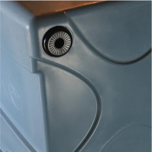 Close-up of the PIERCE VaxMate Vaccine Cooler in gray plastic, featuring a small round ventilation/drainage hole—ideal for safely storing veterinary supplies.