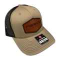 Tan and black mesh adjustable ball cap from PIERCE, featuring a leather patch and a Richardson 112 label on the brim, perfect for enhancing any hat collection.